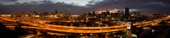 Photo of Johnannesburg in early morning sunrise over the city of Johannesburg, shot looking East with the M1 Highway in the foreground